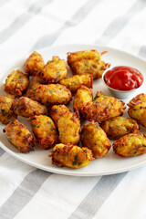 Homemade Fried Tater Tots on a Plate, side view.