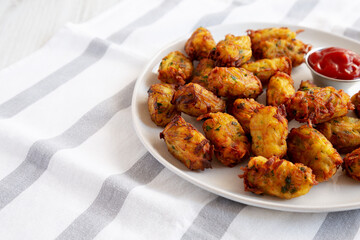 Homemade Fried Tater Tots on a Plate, side view. Space for text.