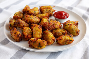Homemade Fried Tater Tots on a Plate, side view.