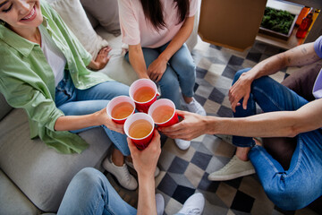 High angle view cropped portrait of group friends arms hold clink drink cups free time chill dorm...