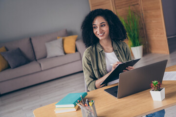 Photo of cheerful positive lady coach dressed shirt creating study program modern gadget indoors...