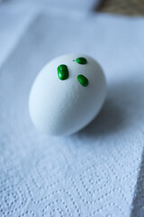 egg with drops of green paint