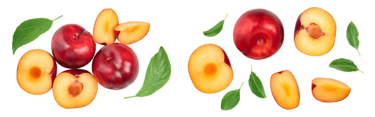 fresh red plum and half with leaves isolated on white background. Top view. Flat lay
