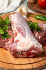Veal shank. Raw beef shank on wood serving board. Close up