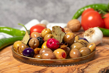 Mixed olives. Special mixed olives prepared with various olives on a wooden serving board. Close up