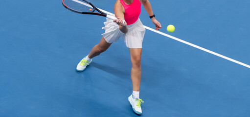 Woman playing tennis on blue floor. Horizontal sport poster, greeting cards, headers, website