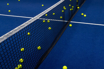 Yellow tennis and padel balls in court on blue turf. Horizontal sport poster, greeting cards, headers, website