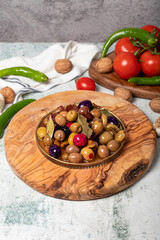 Mixed olives. Special mixed olives prepared with various olives on a wooden serving board