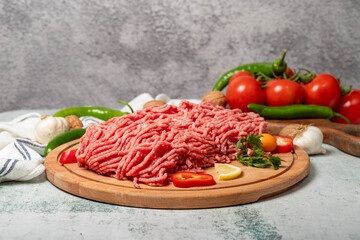 Ground beef. Raw ground beef or minced meat on wood serving board