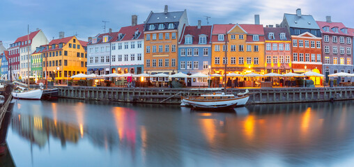 Panorama of Nyhavn with colorful facades of old houses and ships in Old Town of Copenhagen, Denmark. - 763588864
