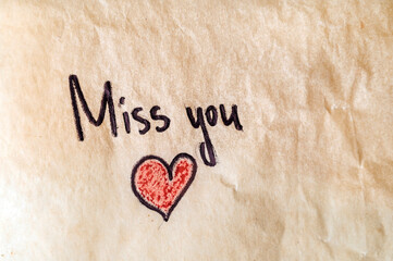 Miss you note on crumpled paper