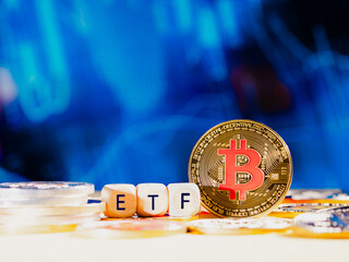 Bitcoin ETF. coin stands against a blurred blue background with financial graphs. Other coins are...