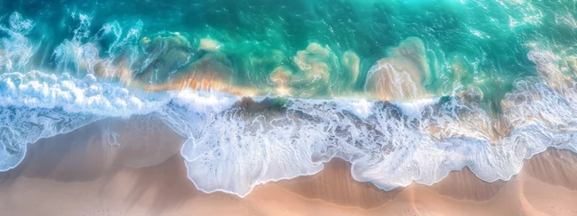 Zelfklevend Fotobehang Ocean waves on the beach as a background. Beautiful natural summer vacation holidays background. Aerial top down view of beach and sea with blue water waves © JovialFox