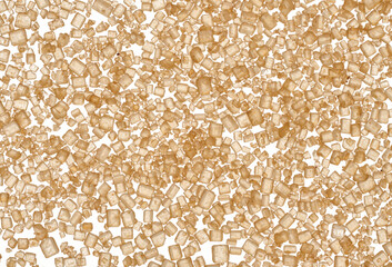 Brown cane sugar granules on isolated background