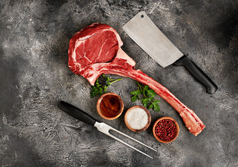 Raw  tomahawk steak on wooden board - 763608218