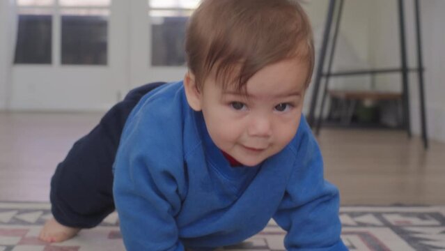 Baby boy crawling all over the house