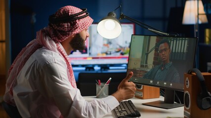 Arab teleworker in video call session with therapist, asking for advice, feeling down. Remotely...