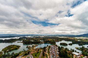 Panoramic aerial view of the Peñon-Guatape reservoir with parking in the foreground in Antioquia, Colombia