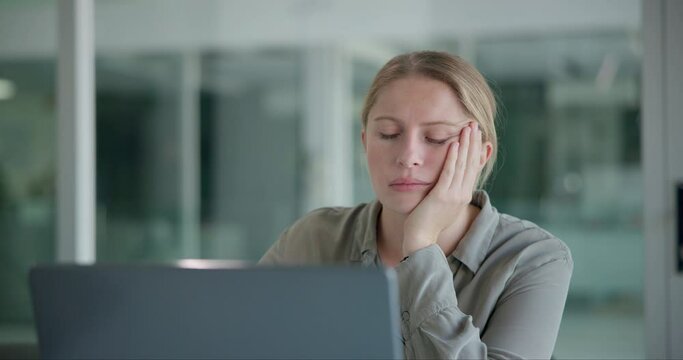 Business, tired and woman with laptop, fatigue and exhausted with burnout and overworked in a modern office. Person, PR consultant and employee with computer and sleepy with stress and mental health