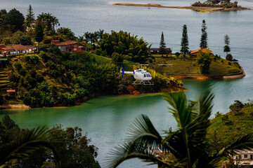 Helicopter flies over the Peñol-Guatape reservoir, near the Rock of Guatape in Antioquia, Colombia
