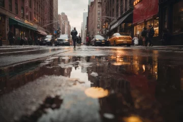 Tuinposter View of highway in New York city with cars and building with puddle of water as reflection effect © free