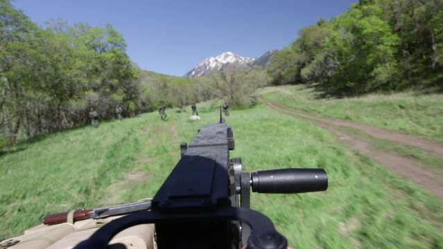 Point of view of WW2 machine gunner in grassy field