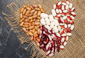 white and red beans in heart shape top view
