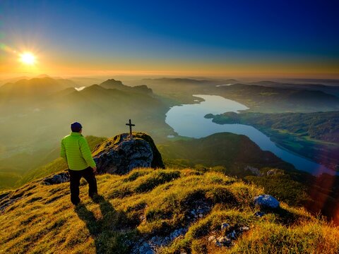 Mountaineer at dusk on the Schafberg, below the Mondsee, Salzkammergut, Salzburger Land, Austria, Europe