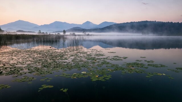 Sunrise with wafts of mist over the Lake Turnersee, Karawanken, Carinthia, Austria, Europe
