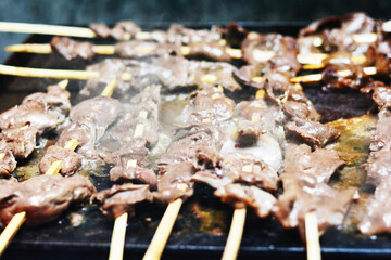 Cooking typical peruvian food anticuchos.Cooking typical peruvian food anticuchos.