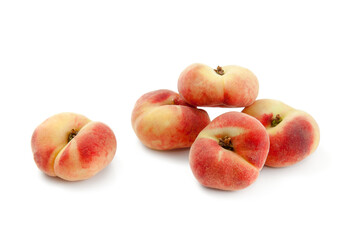 Several saturn peaches or flat peaches isolated on white background with clipping path..