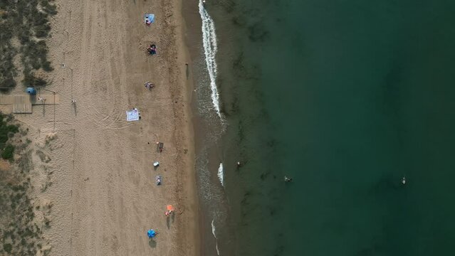 Aerial video of Gav Spain coastline and people vacationing. near Barcelona Spain