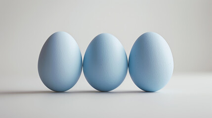 Pastel blue Easter eggs on a light background.