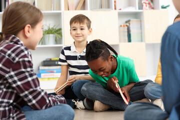 Cute children having fun in classroom at school