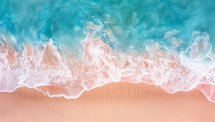 Overhead shot captures the soft foam of waves caressing a sunlit sandy coastline. - obrazy, fototapety, plakaty