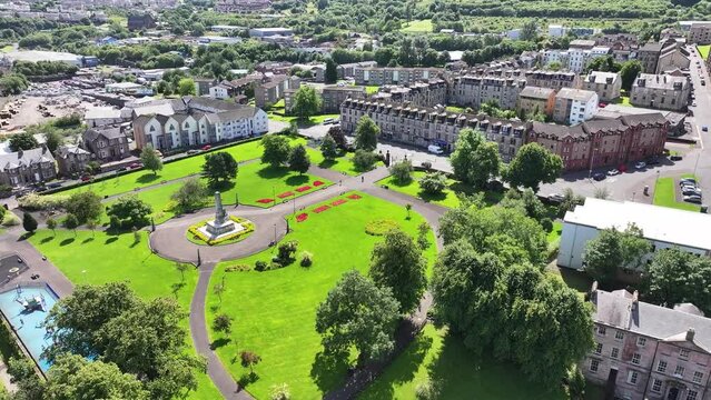 Aerial View of Wellpark in Downtown Greenock, Scotland UK. Cenotaph Memorial and Buildings on Sunny Day 60fps