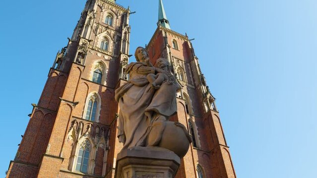 Statue of Our Lady Mother of God and Cathedral of St. John the Baptist at Cathedral Island (Ostrow Tumski) Statue of most blessed virgin mother of god - Wroclaw, Poland