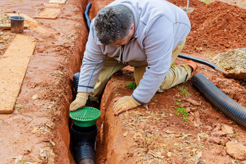 Laying underground drainage pipe system for outflow of rain stormwater