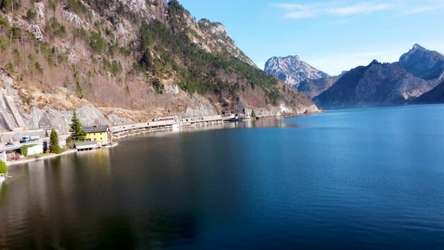 Mountainous lakeside view of Ebensee in the Salzkammergut region, catching Trainride, Upper Austria, on a clear day, aerial perspective,