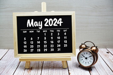 May 2024 monthly calendar on chalkboard for planning and management - obrazy, fototapety, plakaty