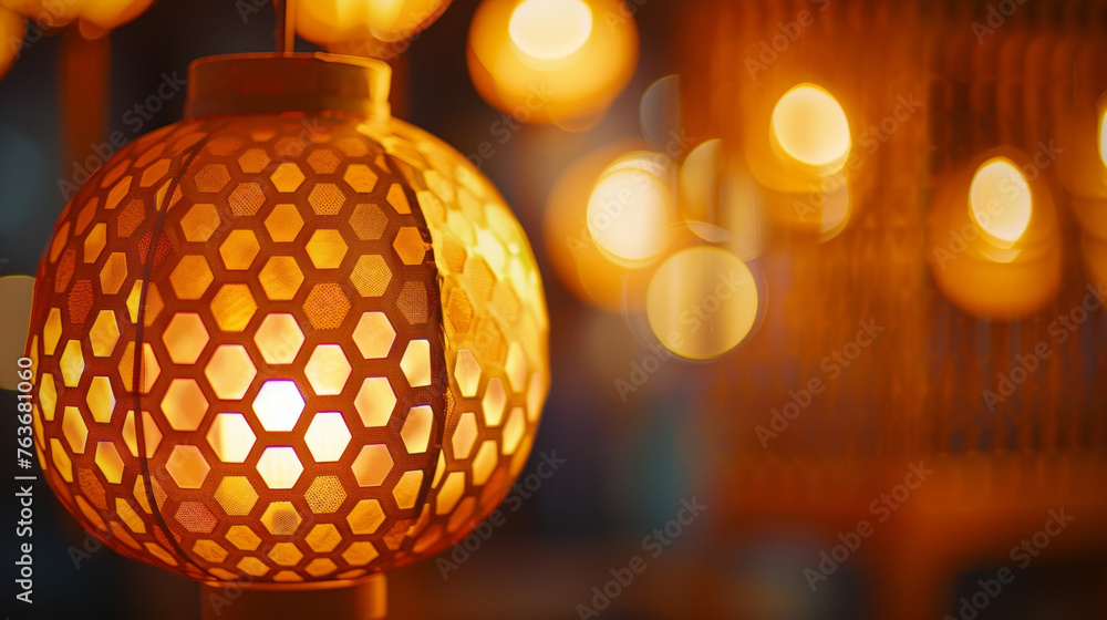Poster a photograph of a paper lantern with intricate outs in the shape of honeycomb cells casting a warm h