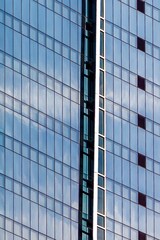 Fototapeta na wymiar Modern office building exterior. Abstract glass windows
