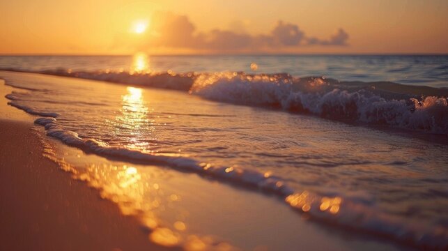 Warm hues paint the sky as gentle waves lap the shore, creating a tranquil and romantic beach sunset.