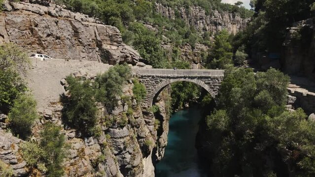 Ancient arch bridge over the Koprucay river gorge in Koprulu national Park in Turkey
