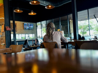 Beautiful scene of a woman in a restaurant bar. The setting has a calm atmosphere.