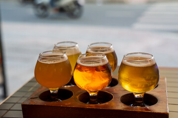 Beer flights are small servings of various beers. There are around 4-8 varieties depending on the brewery. Customers will receive a small 3 – 5 oz. glass of each beer. There are photo, vector versions