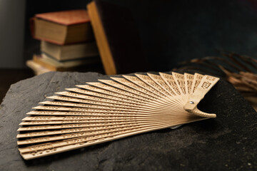 wooden fan with die cut details