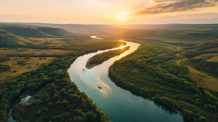 Aerial view of a river carving through a landscape at dawnultra HD - obrazy, fototapety, plakaty