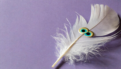 Obraz premium minimal postcard with white feather and eyes over purple background