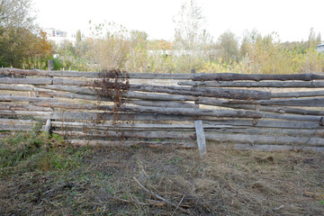 Fototapeta na wymiar old wooden fence in the garden